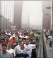  ?? PHOTO/DARRYL BUSH ?? In this July 13, 1997 file photo, San Francisco Marathon runners cross the Golden Gate Bridge. AP