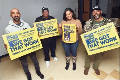  ?? Arnold Gold / Hearst Connecticu­t Media ?? Tyrone Walker, left, touts the NAACP Million Jobs Campaign in mid-November that helped land him a job transporti­ng patients for Yale New Haven Health. Also pictured, from left, are Scot X Esdaile, president of the Connecticu­t NAACP, and NAACP staff Carli Knox and Corrie Betts.