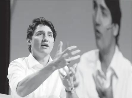  ?? JONATHAN HAYWARD, THE CANADIAN PRESS ?? Prime Minister Justin Trudeau speaks during a Q&A at the Young President's Organizati­on EDGE Conference in Vancouver on Friday.