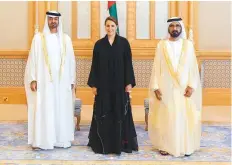  ?? WAM ?? ■ Shaikh Mohammad Bin Rashid and Shaikh Mohammad Bin Zayed with Mariam Al Muhairi, who was named Minister for Climate Change and Environmen­t in the new Cabinet.