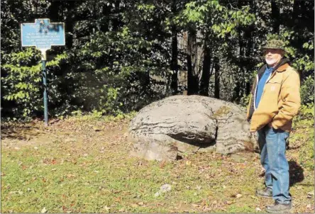  ?? PHOTOS BY MIKE YEOMAN — SPECIAL TO THE DISPATCH ?? Russ Cary stands by “The Oneida Stone of 1615” on the grounds at Nichols Pond Park. A marker on the site reads “An Altar and Council Place.”