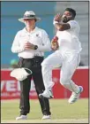  ??  ?? Sri Lanka fast bowler Lahiru Kumara passes umpire Bruce Oxenford to bowl during the second Test against Pakistan in Karachi, Pakistan, on Dec 19. (AP)