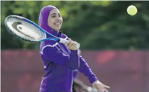  ??  ?? Deering High School sophomore Tabarek Kadhim says her sports hijab shows that others are accepting of her Muslim faith.
