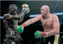  ??  ?? Deontay Wilder and Tyson Fury had a ding-dong battle in their first fight with a resulting draw setting up a likely rematch. GETTY IMAGES