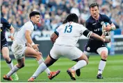  ??  ?? Pushed wide: Peter Horne is faced by France centre Mathieu Bastareaud