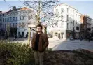  ?? Benjamin Van Bunderen Robberecht­s, who tried to save Rosa’s life, at her memorial tree in Brussels. Photograph: Judith Jockel/ The Guardian ??