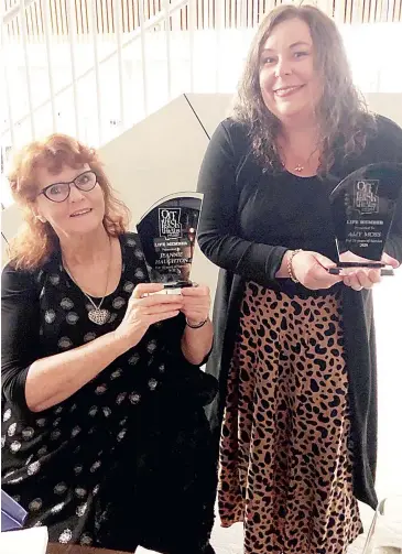  ??  ?? Jeannie Haughton (left) and Amy Moss gain the first life membership­s of Off the Leash Theatre during a small dinner at the West Gippsland Arts Centre.