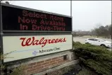  ?? NAM Y. HUH-ASSOCIATED PRESS ?? In this March 27, 2020, file photo, a Walgreens sign is displayed outside the store in Wheeling, Ill.