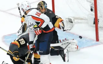  ?? AP PHOTO ?? Washington Capitals forward Brett Connolly, centre, screens Vegas Golden Knights goaltender Marc-Andre Fleury as the puck goes past Fleury and into the net during Game 2 of the Stanley Cup final in Las Vegas. The teams will be back in Vegas on Thursday...