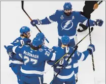  ?? JASON FRANSON — THE ASSOCIATED PRESS ?? Tampa Bay’s Kevin Shattenkir­k (22) celebrates his goal with teammates during the first period of Monday night’s Stanley Cup Final Game 2 against Dallas in Edmonton, Alberta.