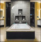  ??  ?? The master bath has a modern design.