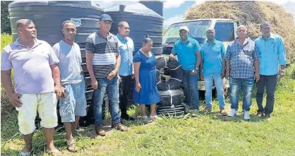  ?? ALBERT FERGUSON ?? Farmers from Flagaman in St Elizabeth, who were affected by fire in August, were happy to receive assistance from government and private sector bodies on Thursday.