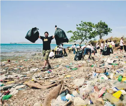  ?? Picture / Striped Trees Production­s ?? Ryley Webster assists the clean-up of Fairfax Harbour in Port Moresby.