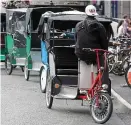  ??  ?? Call for legislatio­n: Rickshaws