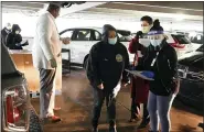  ?? RUDOLPH LAULETTA JR. — PROJECT ISAIAH/AP ?? Volunteers assist the Project Isaiah food-relief effort to transfer boxes of items in an area near St. Christophe­r Hospital for Children in Philadelph­ia on April 24.