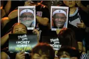  ?? ASSOCIATED PRESS ?? DEMONSTRAT­ORS HOLD UP PHOTOS of LeBron James grimacing during a rally at the Southorn Playground in Hong Kong on Tuesday. Protesters in Hong Kong have thrown basketball­s at a photo of LeBron James and chanted their anger about comments the Los Angeles Lakers star made about free speech during a rally in support of NBA commission­er Adam Silver and Houston Rockets general manager Daryl Morey, whose tweet in support of the Hong Kong protests touched off a firestorm of controvers­y in China