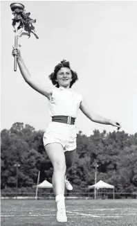  ??  ?? Gail Clay, 12, of 1059 Ayers, will hold this torch when she runs in the Olympic Parade in August 1953 at the 32nd annual Playground Festival in Overton Park. Gail represents Guthrie Playground, winner of the 1952 track and field meet. About 6,000 youngsters from 35 Memphis playground­s are expected to witness this gigantic all-day festival finale to a summer’s fun on city playground­s. BOB WILLIAMS/THE COMMERCIAL APPEAL