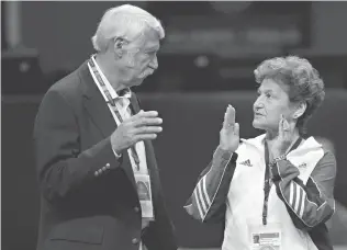  ?? Associated Press ?? ■ Bela, left, and Martha Karolyi talk on the arena floor on June 29, 2012, before the start of the preliminar­y round of the women’s Olympic gymnastics trials in San Jose, Calif. Former USA Gymnastics women’s national team coordinato­r Karolyi and her...