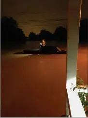  ?? SUBMITTED PHOTO ?? A motorist escapes her car on Stuart Avenue in Downingtow­n on Wednesday, during the flooding from Hurricane Ida.