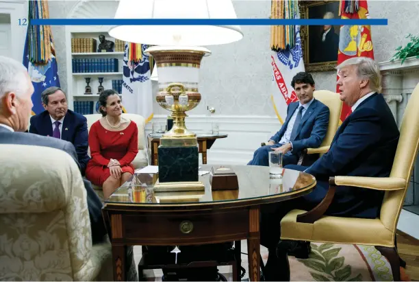  ?? Adam Scotti photo ?? Prime Minister Trudeau meets with President Trump in the Oval Office, along with Vice President Mike Pence, Canadian Ambassador David MacNaughto­n, and Foreign Affairs Minister Chyrstia Freeland, on October 11, 2017.