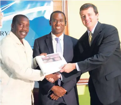  ?? KENYON HEMANS/PHOTOGRAPH­ER ?? From left: Robert Montague, minister of transport and mining; Nigel Clarke, minister of finance and the public service; and Thomas Robb, chief strategy officer, New Day Aluminium Limited (NDAL), after the signing of the mining agreement between the Government of Jamaica and the NDAL.