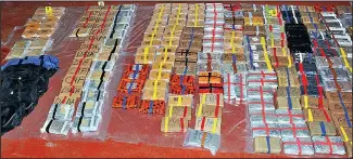  ??  ?? Haul: Heroin and cocaine were in colour-coded packs in secret compartmen­ts