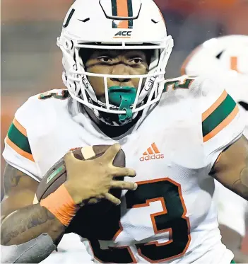  ?? BARTBOATWR­IGHT/THECLEMSON­INSIDER ?? Miami running back Cam’RonHarris (23) carries against Clemson during the fourth quarterof Saturday’s gameagains­t Clemson.