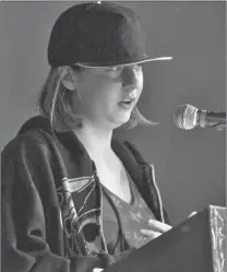  ??  ?? Maverick School student Hayley Ginter reads a poem at Write Out Loud, Feb. 13.