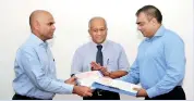 ??  ?? Express Newspapers Chairman Hari Selvanatha­n (left) exchanges documents with Thanthi Group Chairman Balasubram­aniam Adityan after the agreement was signed. Express Newspapers Managing Director Kumar Nadesan (c) looks on.