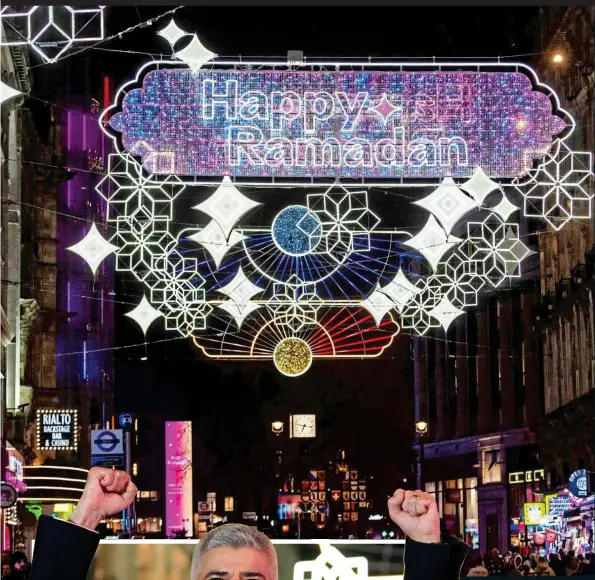  ?? ?? LIGHT SHOW: London’s display for the Islamic fasting month, which Mayor Sadiq Khan, left, switched on