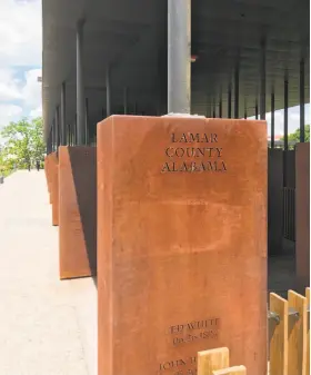  ?? Photos by Ian Magruder ?? Steel columns at the National Memorial for Peace and Justice in Alabama are etched with the names of the lynched and the counties where they were slain.