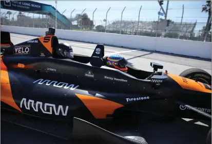  ?? PHOTOS BY HOWARD FRESHMAN ?? Clara Harter sits behind retired IndyCar driver Davey Hamilton on Tuesday for a preview of the Grand Prix of Long Beach course.