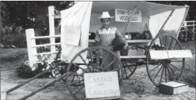  ?? Contribute­d ?? Don Rampone in front of the vegetable “wagon” stand.