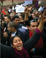  ?? MARTIN BUREAU/AFP/GETTY IMAGES ?? Protesters shout during a demonstrat­ion against the party of Tunisia’s longtime dictator on Jan. 20, 2011, in Tunis.