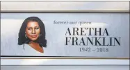  ?? Bill Pugliano / Getty Images ?? A sign tribute to soul music icon Aretha Franklin sits on a hearse outside Greater Grace Temple during her funeral on Friday in Detroit.