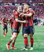  ?? MIGUEL MARTINEZ/AJC 2024 ?? Atlanta United forward Giorgos Giakoumaki­s (right) projects to be the club’s highest-paid player, with a guaranteed compensati­on of $2,248,417 that puts the Five Stripes’ top scorer ahead of Thiago Almada in salary.
