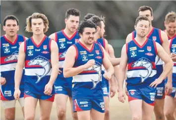  ??  ?? ALL OVER: Dejected Queensclif­f players leave the field after the loss to Modewarre on Saturday.