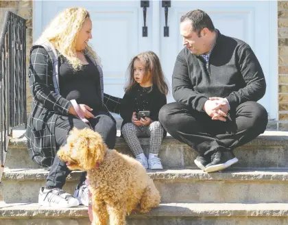  ?? JOHN MAHONEY ?? Corinne Balaila, pictured with husband Kevin Engels and daughter Andie, is expecting her second child in July and had been planning to give birth at the Jewish General Hospital. Now she is considerin­g switching hospitals so her husband can attend the birth.