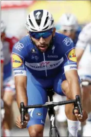  ?? CHRISTOPHE ENA — THE ASSOCIATED PRESS ?? Colombia’s Fernando Gaviria, crosses the finish line to win the fourth stage of the Tour de France cycling race over 195 kilometers (121 miles) with start in La Baule and finish in Sarzeau, France, Tuesday. Slovakia’s Peter Sagan, finished second and...