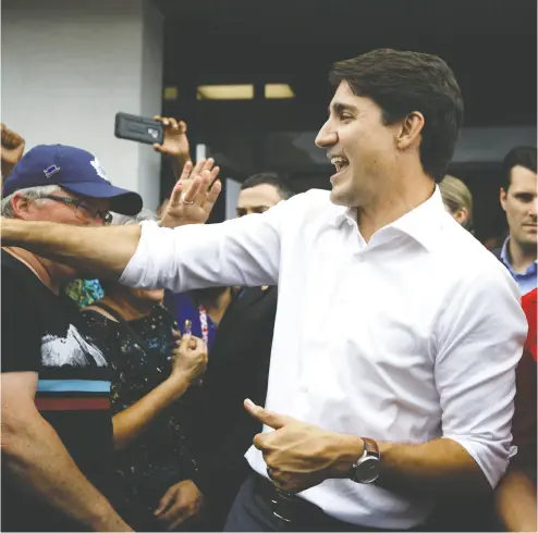  ?? COLE BURSTON/ GETTY IMAGES ?? Liberal Leader Justin Trudeau greets supporters during a campaign stop earlier this week in Niagara Falls, Ont.