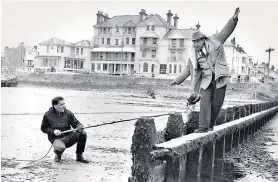  ?? ?? g ‘He could go through 30 expression­s in five seconds’: far left, Tony Hancock in Hancock’s Half Hour (1960); and, left, filming The Punch and Judy Man (1963) in Bognor Regis