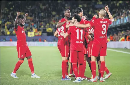  ?? ?? Liverpool’s Sadio Mane celebrates with his team-mates after scoring their third goal against Villarreal.