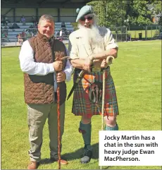  ??  ?? Jocky Martin has a chat in the sun with heavy judge Ewan MacPherson.