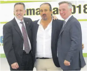  ??  ?? Jamaica’s Jason Mckay (centre) is flanked by bg wigs of ISKA at the recent ISKA Amateur World Championsh­ips held at the Montego Bay Convention Centre. At left is Corey Schafer, world president of ISKA, while at right is Paul Hennessy, the European president.