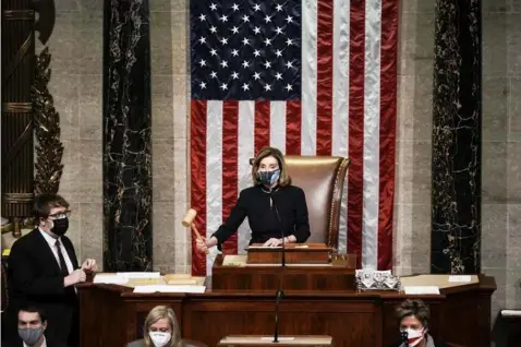  ?? (AP Photo/J. Scott Applewhite) ?? FINAL VOTE. Speaker of the House Nancy Pelosi, D-Calif., leads the final vote of the impeachmen­t of President Donald Trump, for his role in inciting an angry mob to storm the Congress last week, at the Capitol in Washington, Wednesday, Jan. 13, 2021.