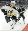  ??  ?? JUSTIN K. ALLER/GETTY Images Bruins forward Milan Lucic, left, battles Steve Sullivan
during a 5-2 loss to the Penguins at Consol Energy Center Sunday in Pittsburgh.