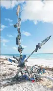  ?? STEVE MACNAULL PHOTO ?? The statue of lost flip-flops on Playa Mujeres.