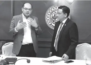  ??  ?? DAVAO City Chamber of Commerce and Industry, Inc. President John Carlo Tria and Department of Finance Secretary Assistant Secretary Antonio Joselito Lambino II discuss issues concerning the local business sector during the press briefing at the Grand Regal Hotel. NICOLE BURLAS