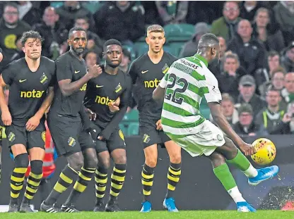  ?? Picture: SNS. ?? Odsonne Edouard defeats the AIK wall to give Celtic a two-goal lead to take to Sweden.