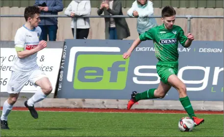  ??  ?? Kerry’s Padraig McCannon look to break away from Harry McEvoy, UCD, in their U-17 SSE Airtricty League game at Mounthawk Park